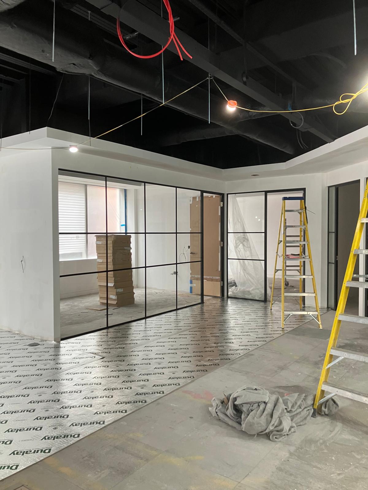 Glass partitions and meeting rooms with floor protection